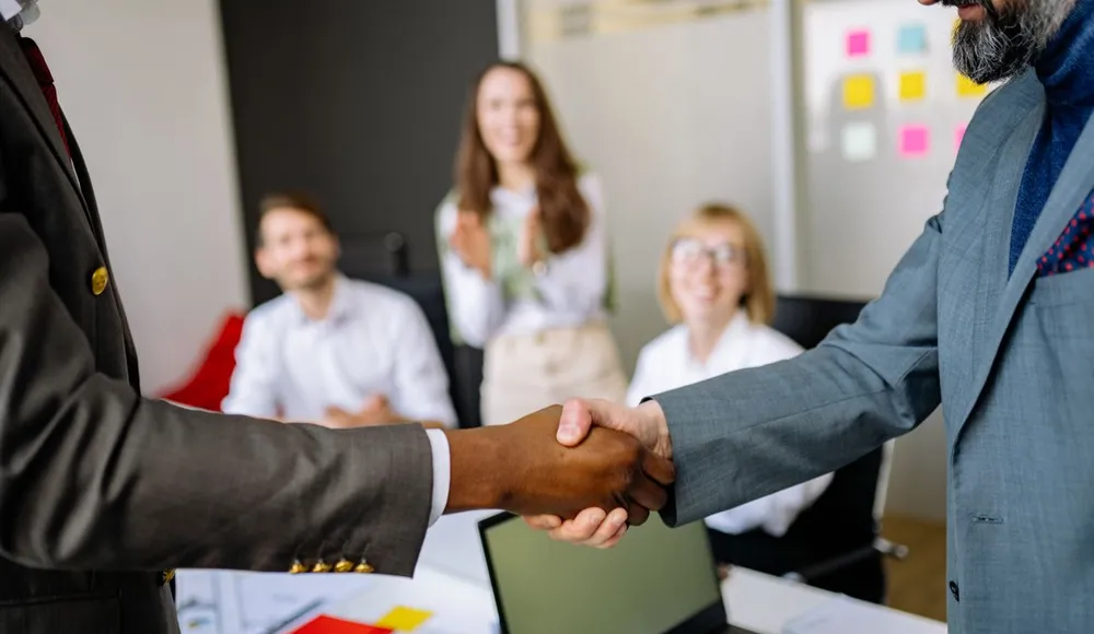 Business handshake approval office meeting for automated workflows