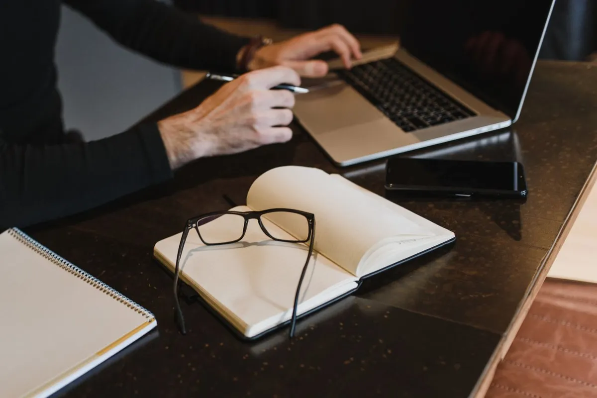 Person reading business notes for software delivery insights