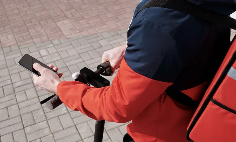 Field technician using mobile service app with GPS job tracking, offline mode, and signature capture